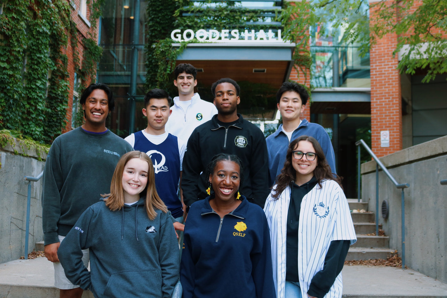 OTD members posing in front of a Goodes Hall.