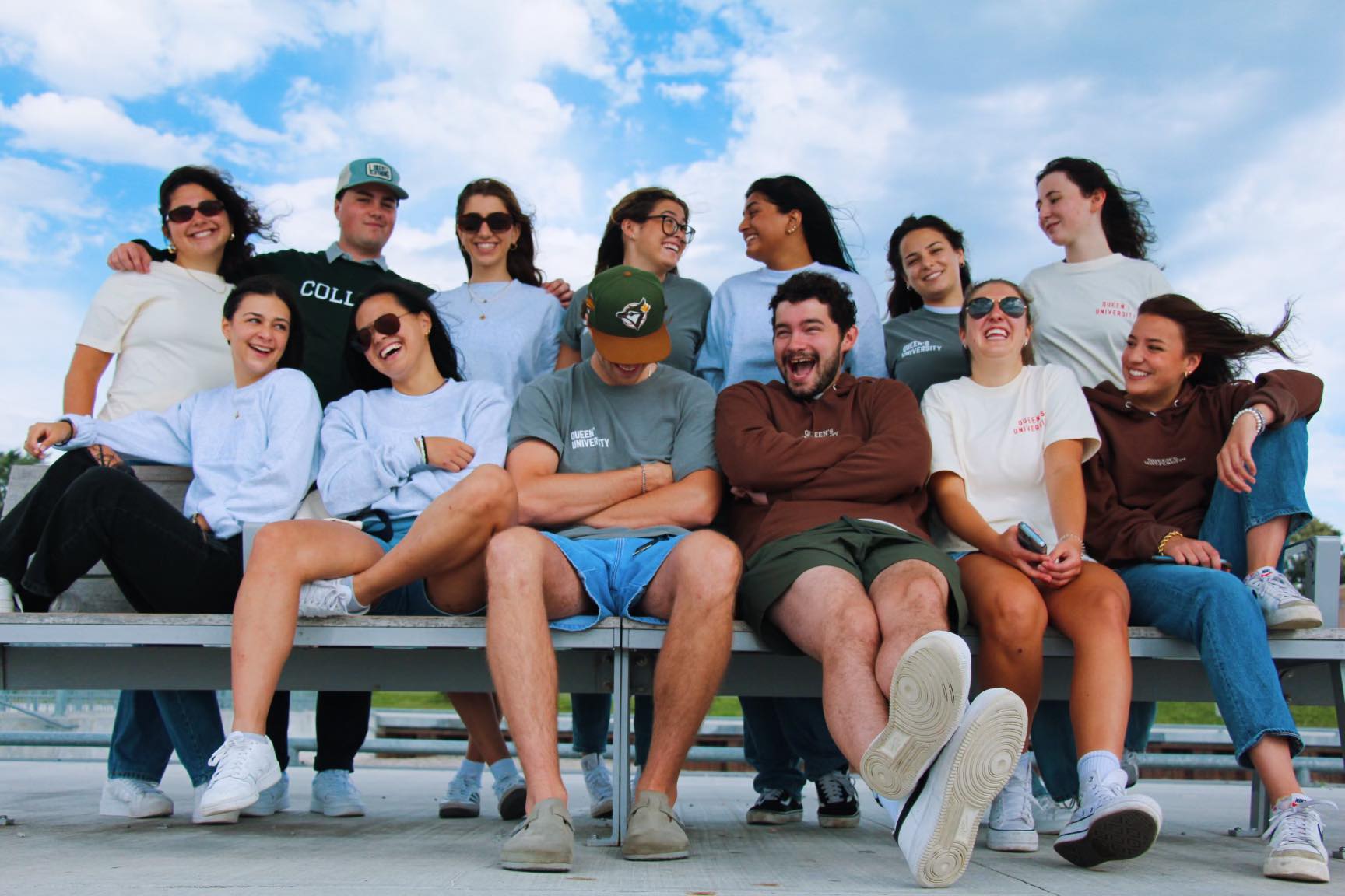 Group of OTD members sitting together on a bench, engaged in conversation and enjoying each other's company.